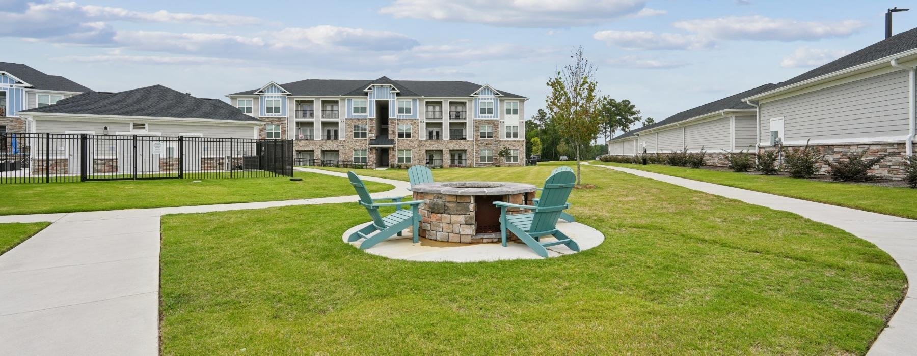 outdoor fire pit surrounded by chairs